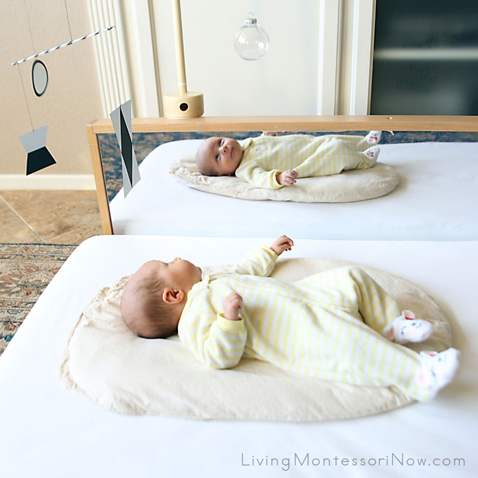 Enjoying her montessori munari mobile 1 month old 1.jpg